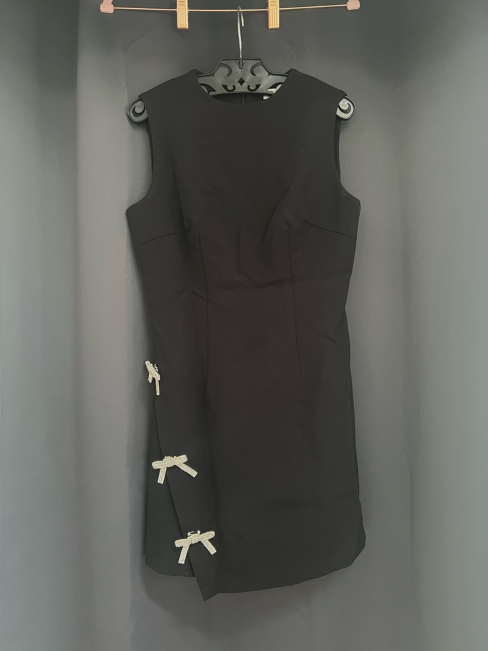Commense Black Sleeveless Mini Dress with Silver Bow Accents